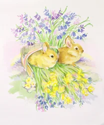 Conejos en una canasta con narcisos y campanillas
