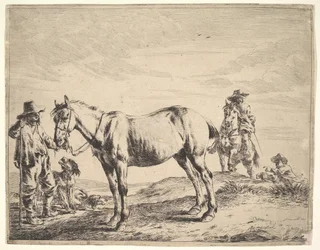 Hombre sosteniendo un caballo por las riendas