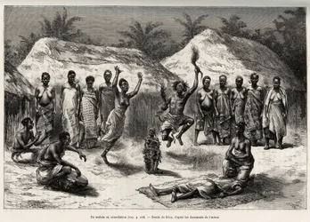 Un paciente en consulta con el agni (o anyi, Costa de Marfil), el doctor brujo realiza una danza, después de colocar un fetiche frente al paciente. Grabado por Riou, para ilustrar la historia “Del Níger al Golfo de Guinea” por el Capitán Louis Gustave Bing