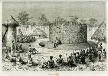 Recepción en Mkwewe, jefe de la tribu, con el narrador. Grabado de Riou para ilustrar la historia Los lagos de África ecuatorial, por Victor Giraud, alférez de barco, en 1883-1885, en Le Tour du monde 1886, bajo la dirección de Edouard Charton (1807-1890),