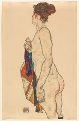 Desnudo de pie con una bata estampada
