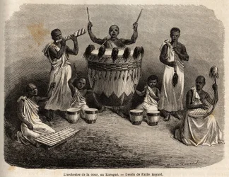 La orquesta de la corte, en el Karague (oeste del Lago Victoria, actual Zimbabue), dibujo de Emile Bayard (1837-1891), ilustrando el viaje de descubrimiento del Capitán Speke en África de 1860 a 1863. Grabado en "Le tour du monde", editado por Edouard Char