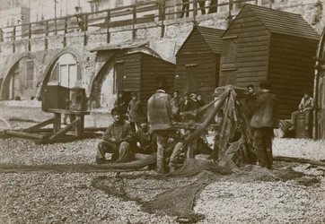 Pescadores con sus redes en la playa de Brighton