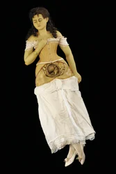 Modelo anatómico de una mujer embarazada (cera y textiles)