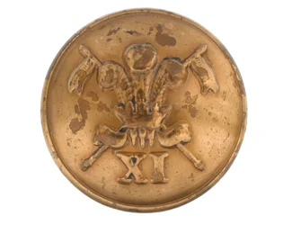 Botón, oficial, 11º