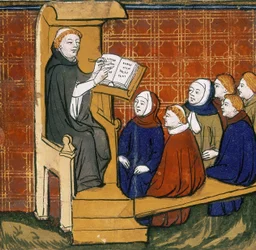 Maestro dominico, sentado con un libro colocado sobre un atril, con los alumnos sentados en el suelo ante él. "Livre des Proprietez des Choses", principios del siglo XV.