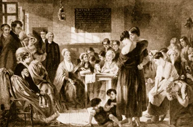 Elizabeth Fry leyendo la Biblia en una prisión