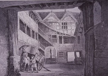 Mozo de cuadra atendiendo a un caballo en el patio del New Inn, Gloucester (xilografía)