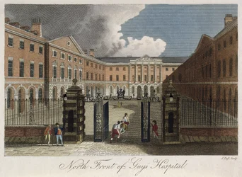 Vista del frente norte del Hospital de Guys, Southwark, mostrando a un hombre siendo llevado en camilla a través de las puertas delanteras, c.1800