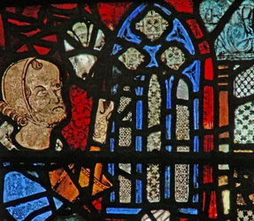 Ventana w39 que representa una figura de donante dando una ventana