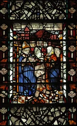 Ventana w58 que representa a Santo Tomás Becket con un prisionero y otras 2 figuras