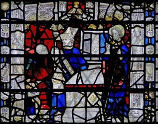 Ventana w6 que representa una escena de la vida de San Nicolás; borde con figuras