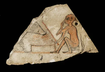 Ostracon mostrando un niño y un cerdo ...