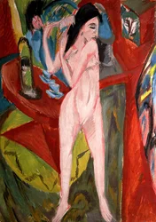 Mujer desnuda peinando su cabello