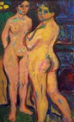 Muchachas desnudas de pie junto a la estufa