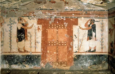 Dos personajes saludando cerca de la puerta que simboliza la entrada al reino de la Muerte (fresco, 530 a.C.)