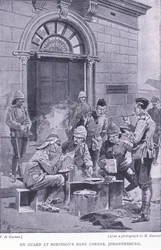 De guardia en la esquina del Banco de Robinson, Johannesburgo, de Después de Pretoria: La Guerra de Guerrillas publicado por Harmsworth Bros Limited