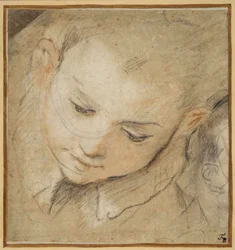 Cabeza de un niño mirando hacia abajo