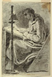 Un artista dibujando a la luz de la lámpara