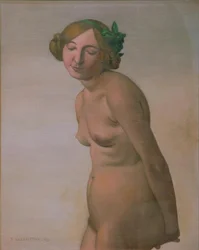 Desnudo femenino con lazo verde en el cabello