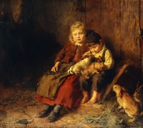 Dos niños jugando con conejos