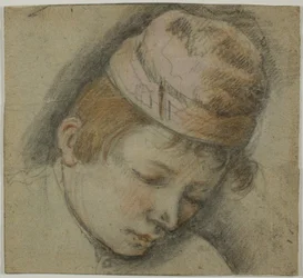 Cabeza de joven con gorra rosa