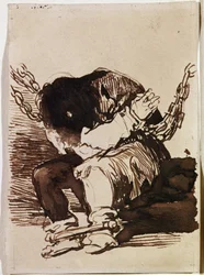 Prisionero encadenado sentado