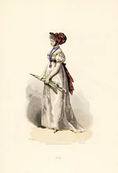 Mujer con vestido blanco con adornos color paja y cinturón de granate