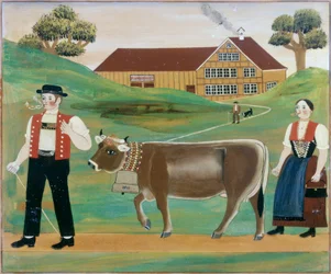 Granjero y granjera con vaca