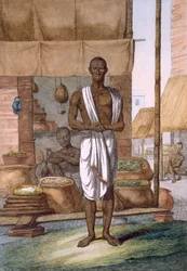 Tendero fuera de su tienda con mercancías en sacos, de 