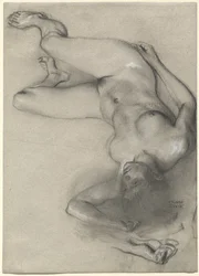 Mujer desnuda tendida en el suelo