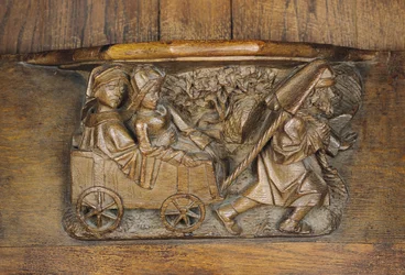 Escultura que representa a una pareja en un carro tirado por un hombre, de un coro (madera)