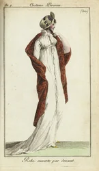 Mujer a la moda con sombrero de paja, vestido y chal