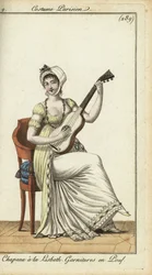 Mujer a la moda tocando la guitarra