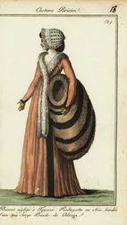 Mujer a la moda con enorme manguito de piel