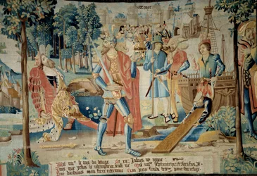 Fundación de la Ciudad de Troyes. El rey Jasio es asesinado por su hermano Dárdano, quien huye en barco y funda Troyes (en Champaña) representada al fondo. Tapiz de “La fabulosa historia de las Galias” realizado por el taller de Arras. 1530 Beauvais, depar