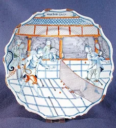 Plato pintado con una escena de tenis