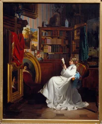 Niña leyendo un libro en una oficina