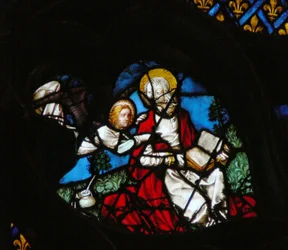 La ventana rosa oeste representando una escena del Libro de Apocalipsis: Apertura del primer sello, con el ángel de Mateo (6:1)