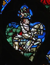 La ventana rosa oeste representando una escena del Libro de Apocalipsis: Caballo pálido con la figura grotesca de la Muerte, armado con una jabalina y víboras. Está emergiendo de la enorme boca verde del infierno