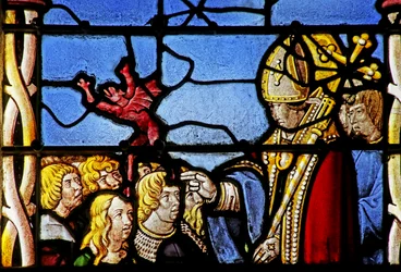 Vidriera que representa a San Cler exorcizando un demonio de Hasterie