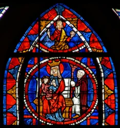 Ventana w109 que representa al donante arrodillado ante la Virgen y el Niño: Cristo en Gloria