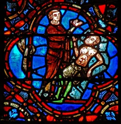 Ventana w12 que representa una escena en la ventana del Buen Samaritano: otro viajero ve al peregrino herido