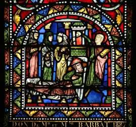 Ventana w13 que representa la comida en la casa de Simón. María Magdalena lava los pies de Cristo