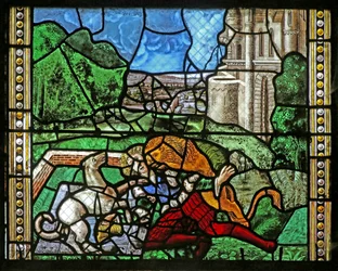 Ventana w16 que representa a Santo Tomás en India invitado a la boda de Pelagio, golpeado por un sirviente que a su vez es devorado por un león. Un perro trae el brazo del sirviente