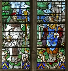Ventana que representa a un santo abad con San Luis