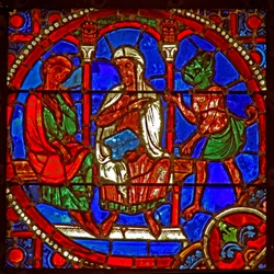 Ventana que representa una escena de la historia de Teófilo: es presentado a Satanás por un mago