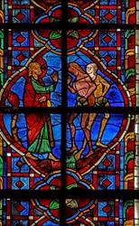 Ventana w207 que representa a Adán y Eva amonestados por comer fruta
