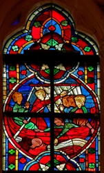 Ventana w209 que representa una escena de una leyenda de San Nicolás: un diablo da un líquido a unos viajeros pero el frasco se pierde por la borda