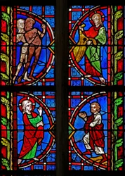 Ventana w30 que representa a Adán y Eva vestidos